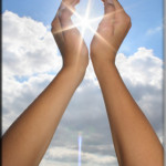 image of hands holding a light representing energy work